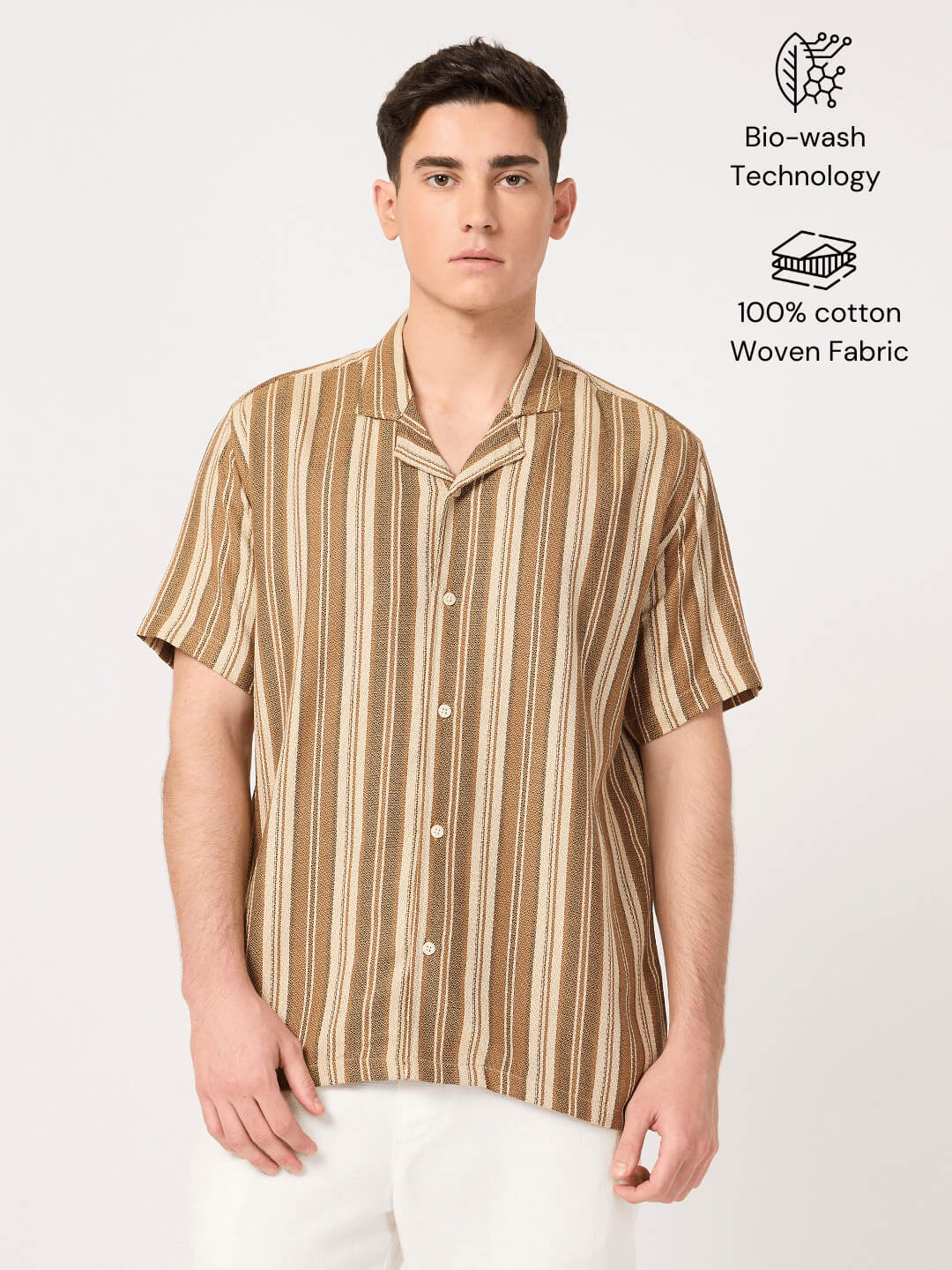 Man wearing a beige and brown striped resort shirt