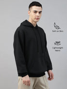 Man wearing a black classic hoodie