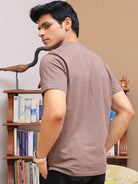 Man wearing a brown crew neck cotton t-shirt