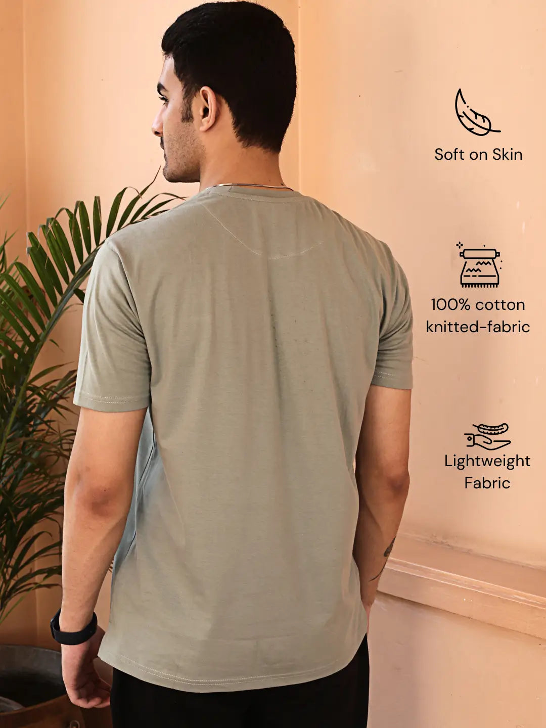 Man wearing a light gray crew neck cotton t-shirt