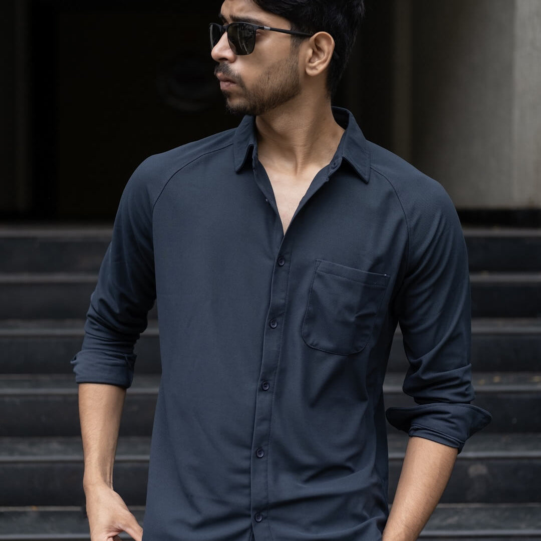 Man wearing a black blue solid shirt
