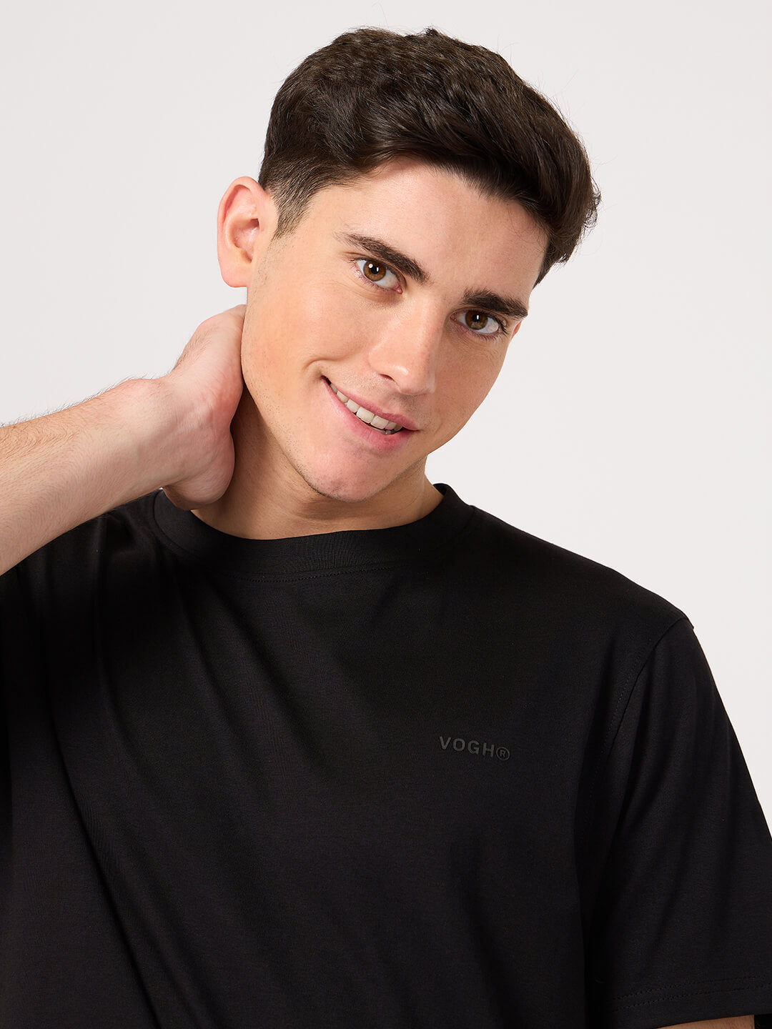 man wearing a plain black tee