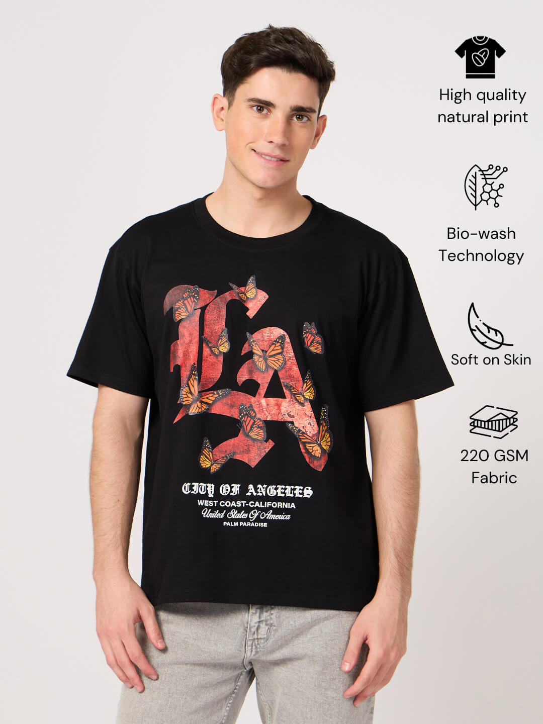 Person wearing a black t-shirt with 'LA City of Angels' design