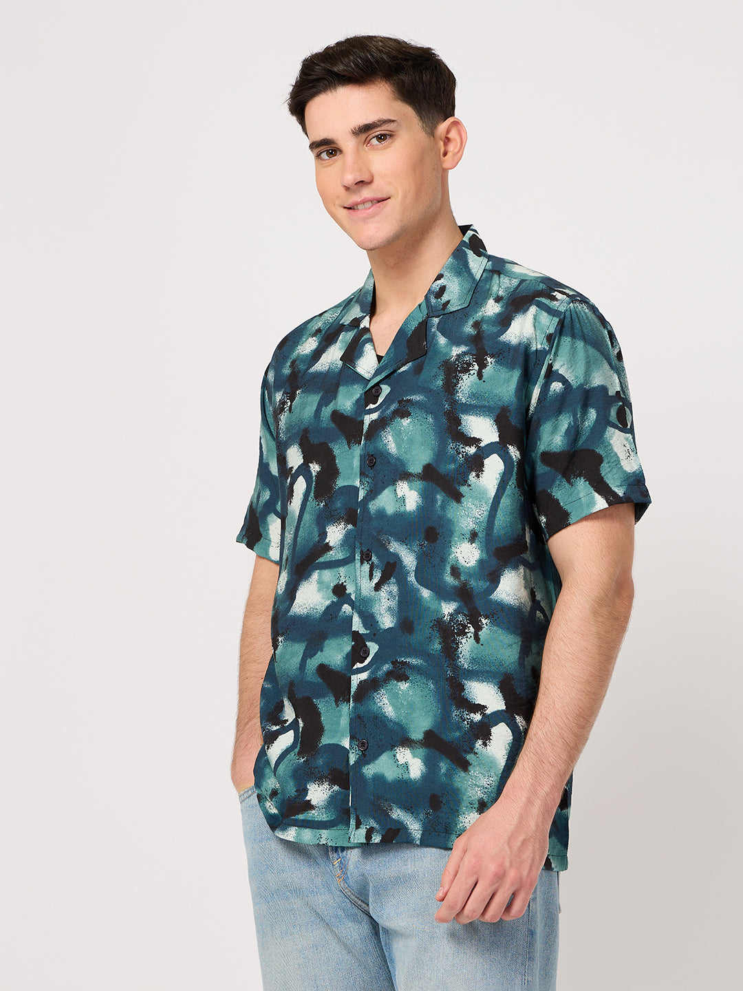 A man wearing a thrust club's rayon resort shirt