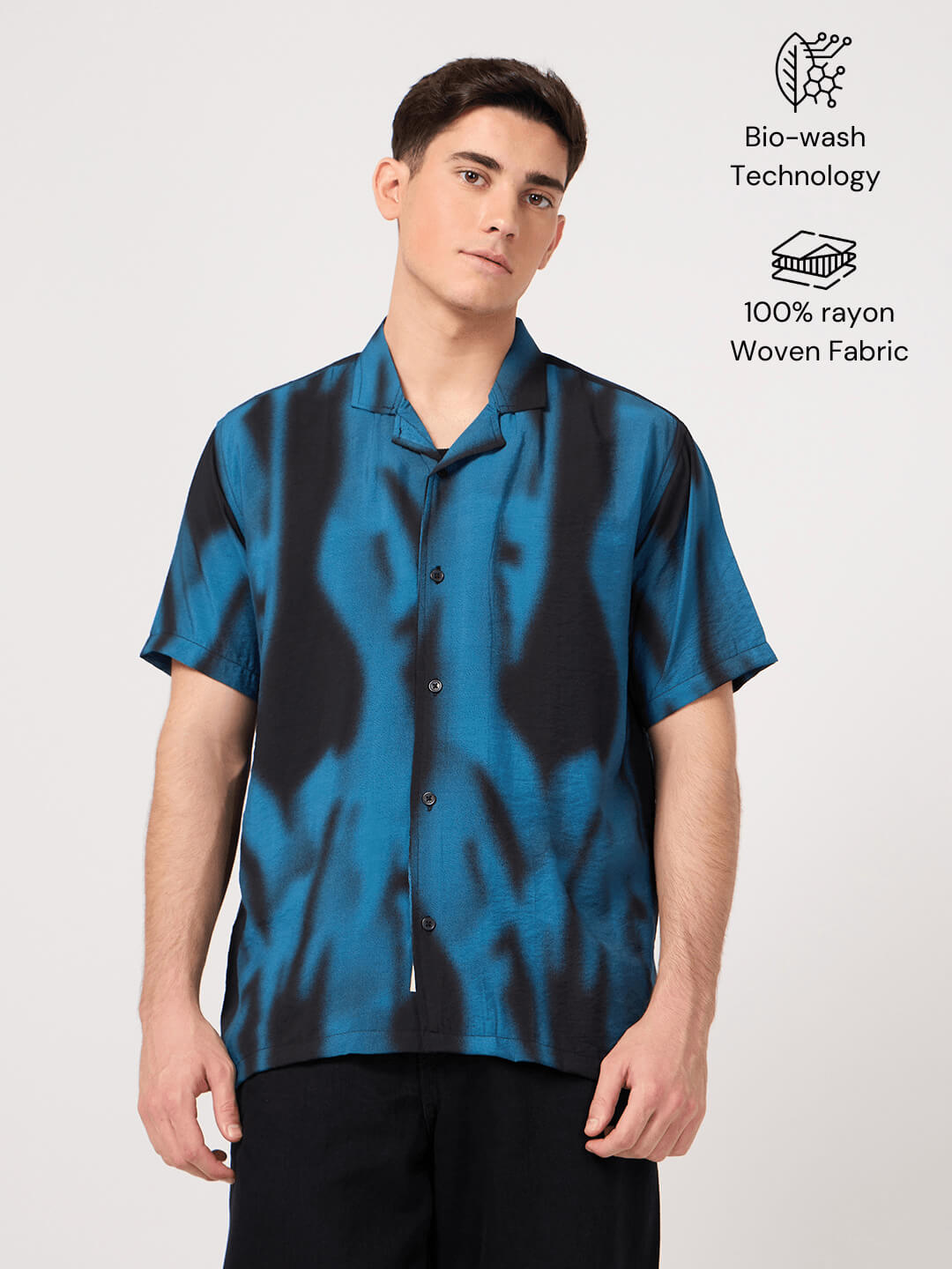 Man wearing a blue and black resort shirt