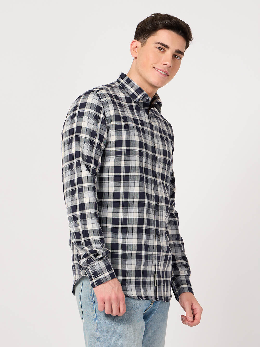 Man wearing a navy and white cotton check shirt