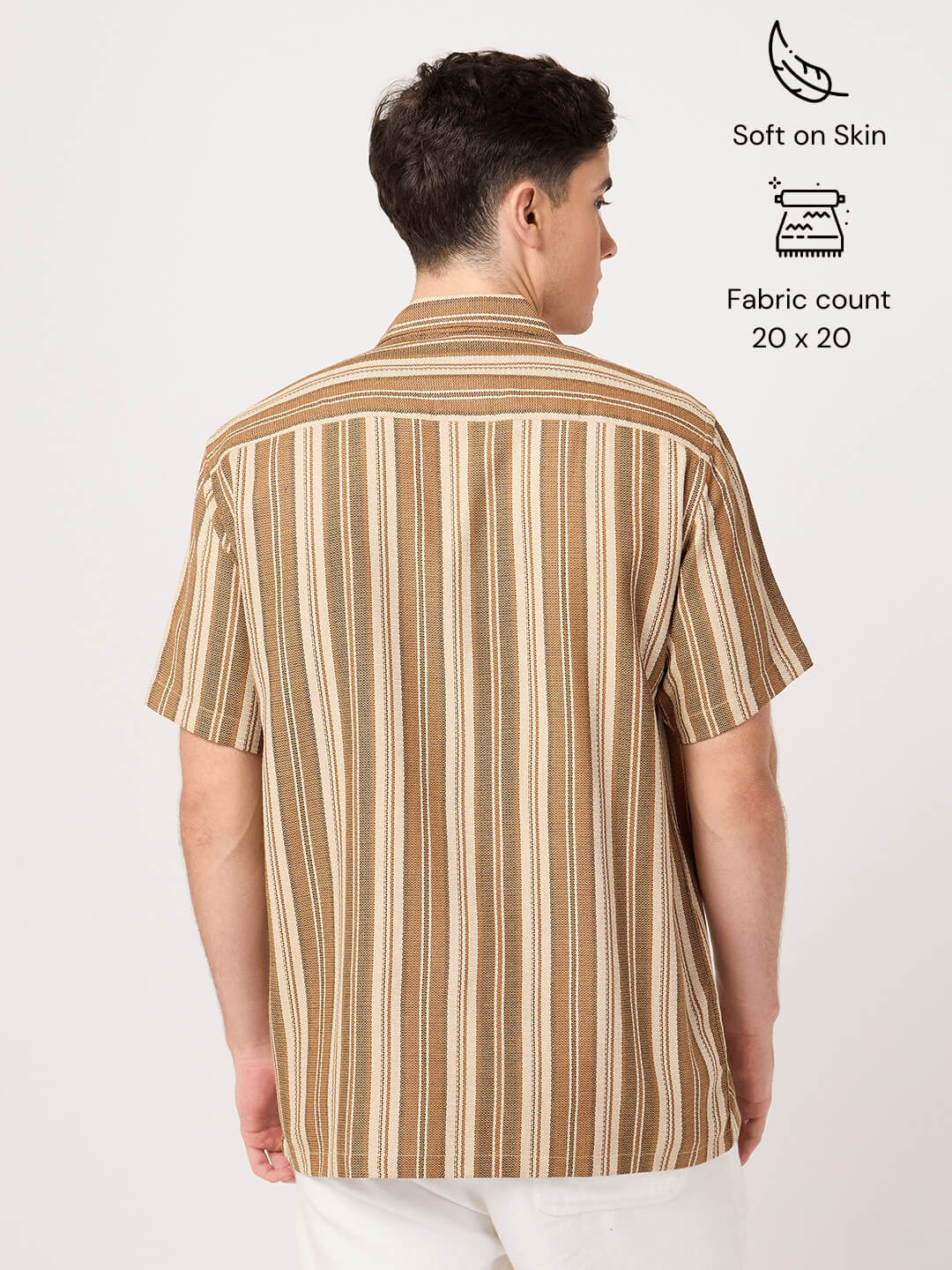 Man wearing a brown and beige striped shirt on a white background