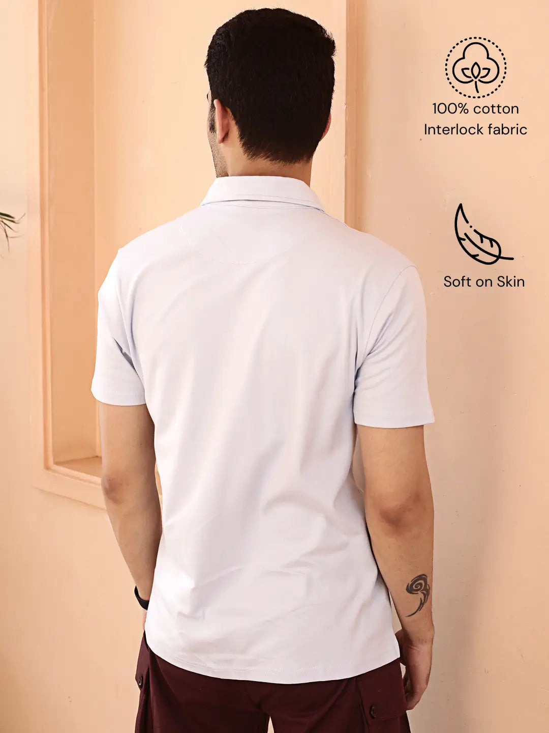 Man wearing a white polo t shirt