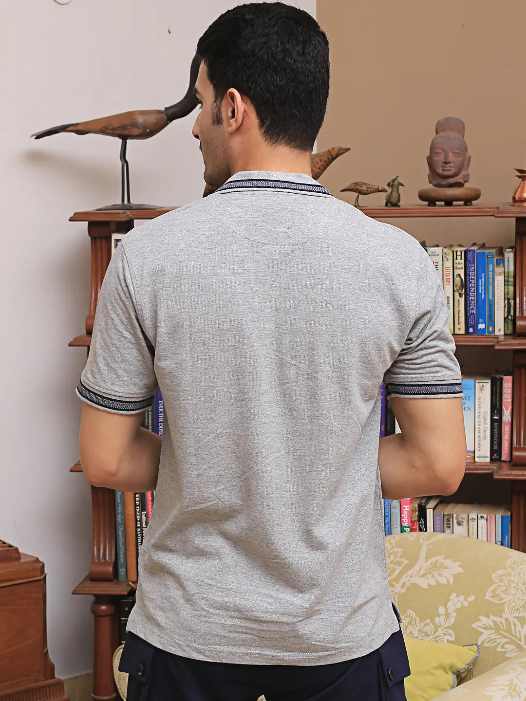 Man wearing a gray polo shirt