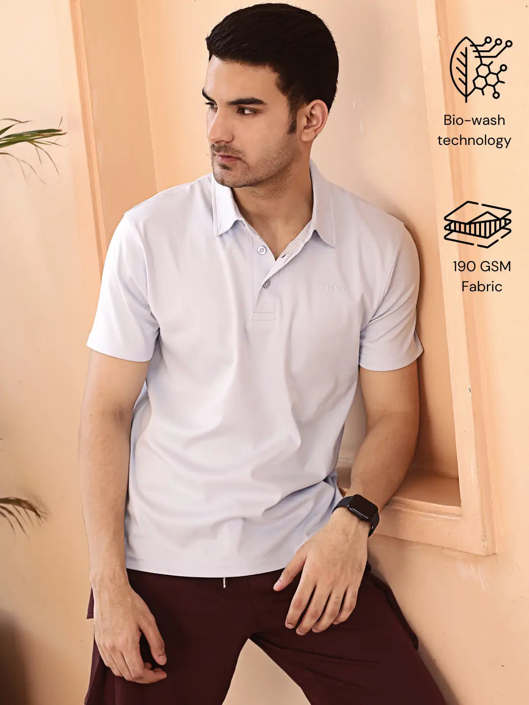 Man wearing a light sky blue polo shirt