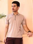 Man wearing a beige polo shirt
