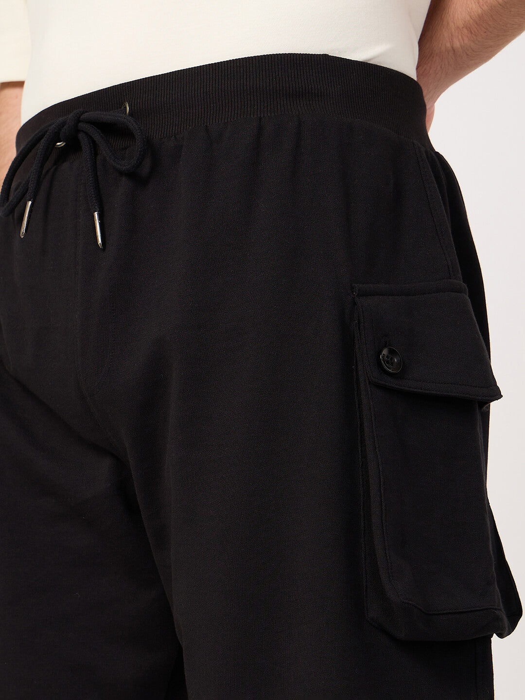 Black cotton cargo shorts with pocket on a white background