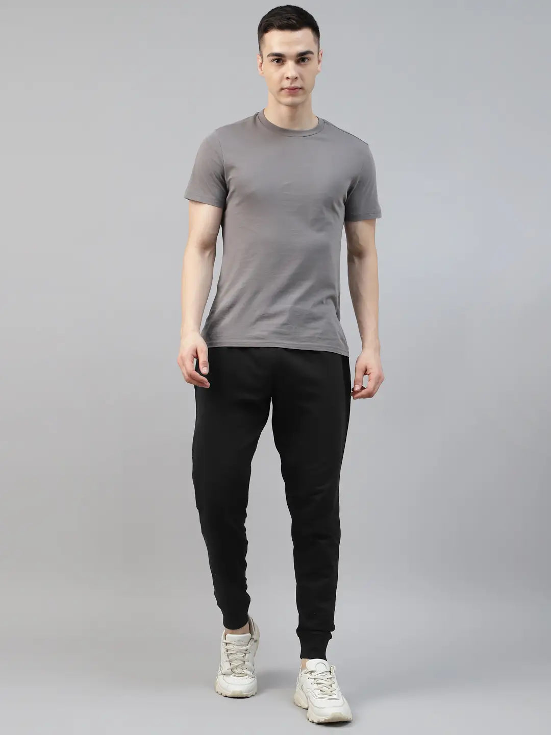 Man wearing a gray t-shirt and black cotton jogger pant