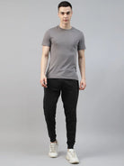 Man wearing a gray t-shirt and black cotton jogger pant