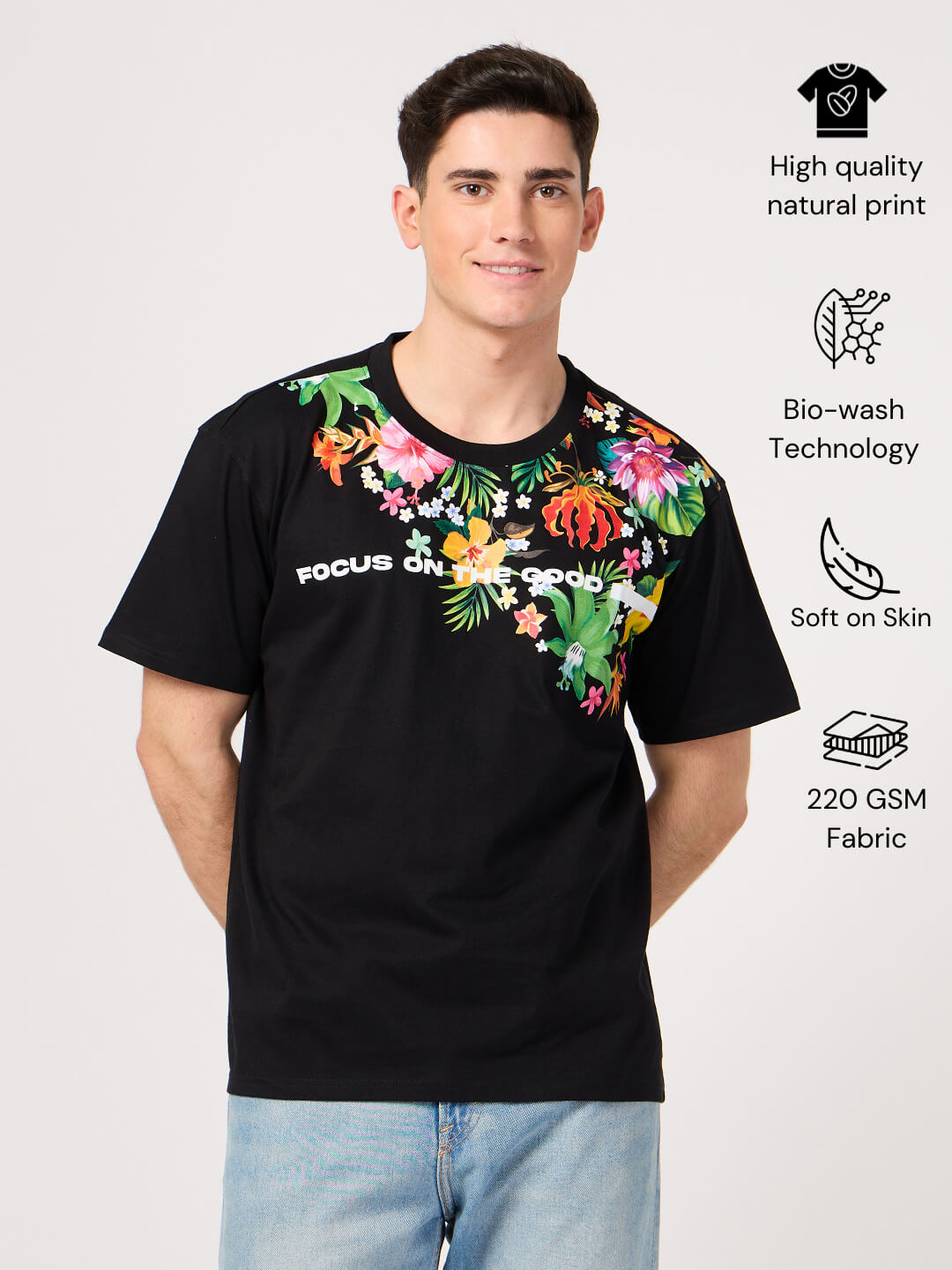 Man wearing a black floral printed t-shirt made ith pure cotton