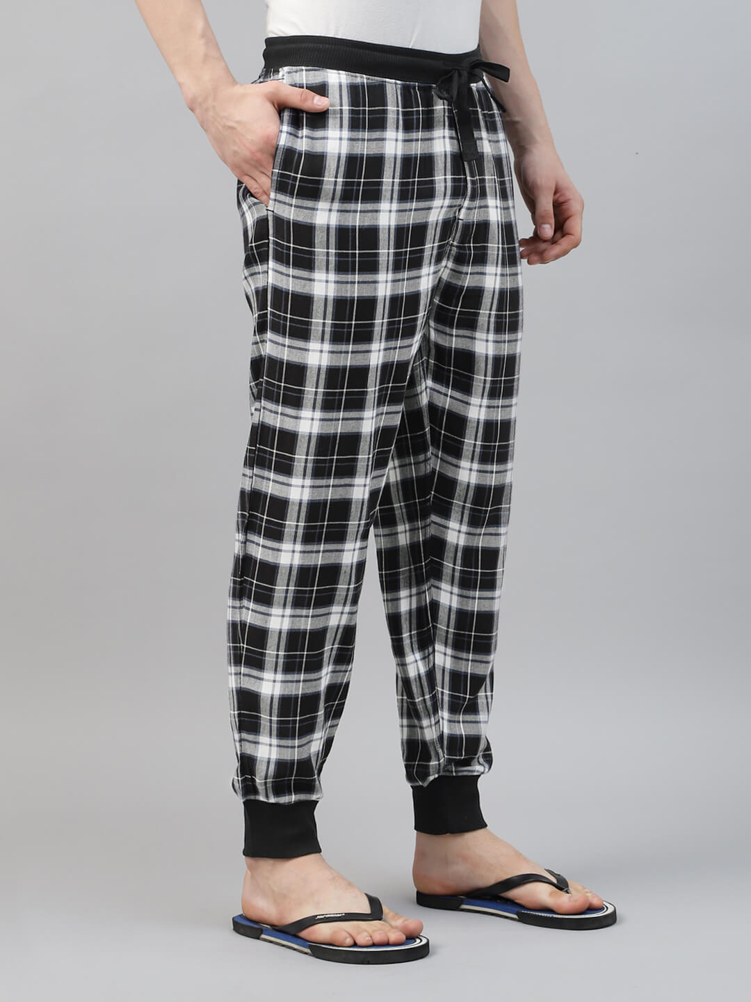 Person wearing black and white check jogger pant