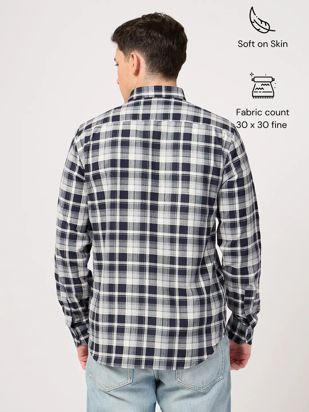 Person wearing a navy and white check shirt with text indicating features