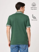 Man wearing a green polo shirt, polo tees for men