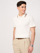 man wearing a classic white polo t-shirt with jacquard collar and trouser
