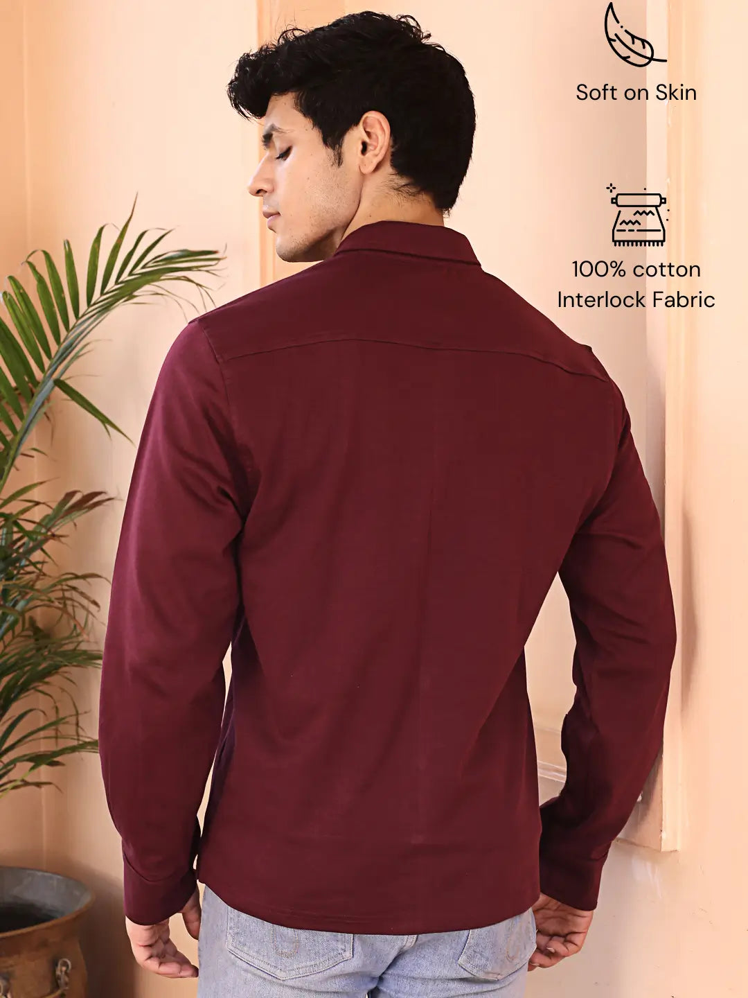 Man wearing a maroon cotton shirt with text indicating 'Soft on Skin' and '100% cotton Interlock Fabric'