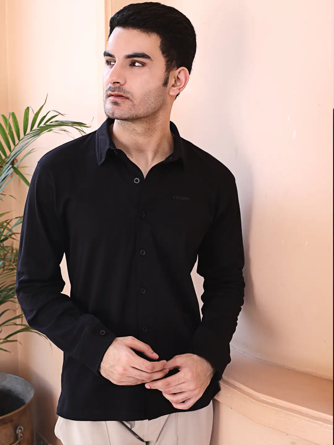 Man wearing a black full-sleeve cotton shirt