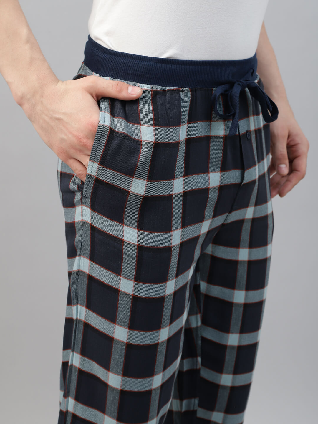 Person wearing navy and gray checkered jogger pant
