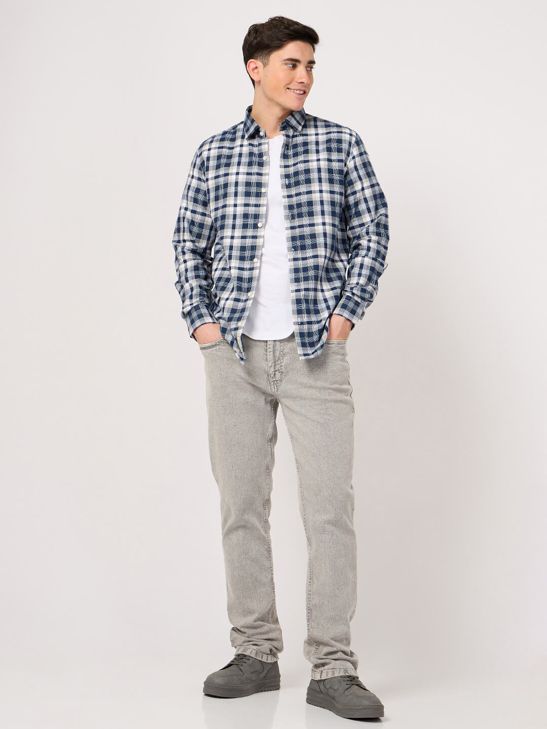 man in blue check shirt