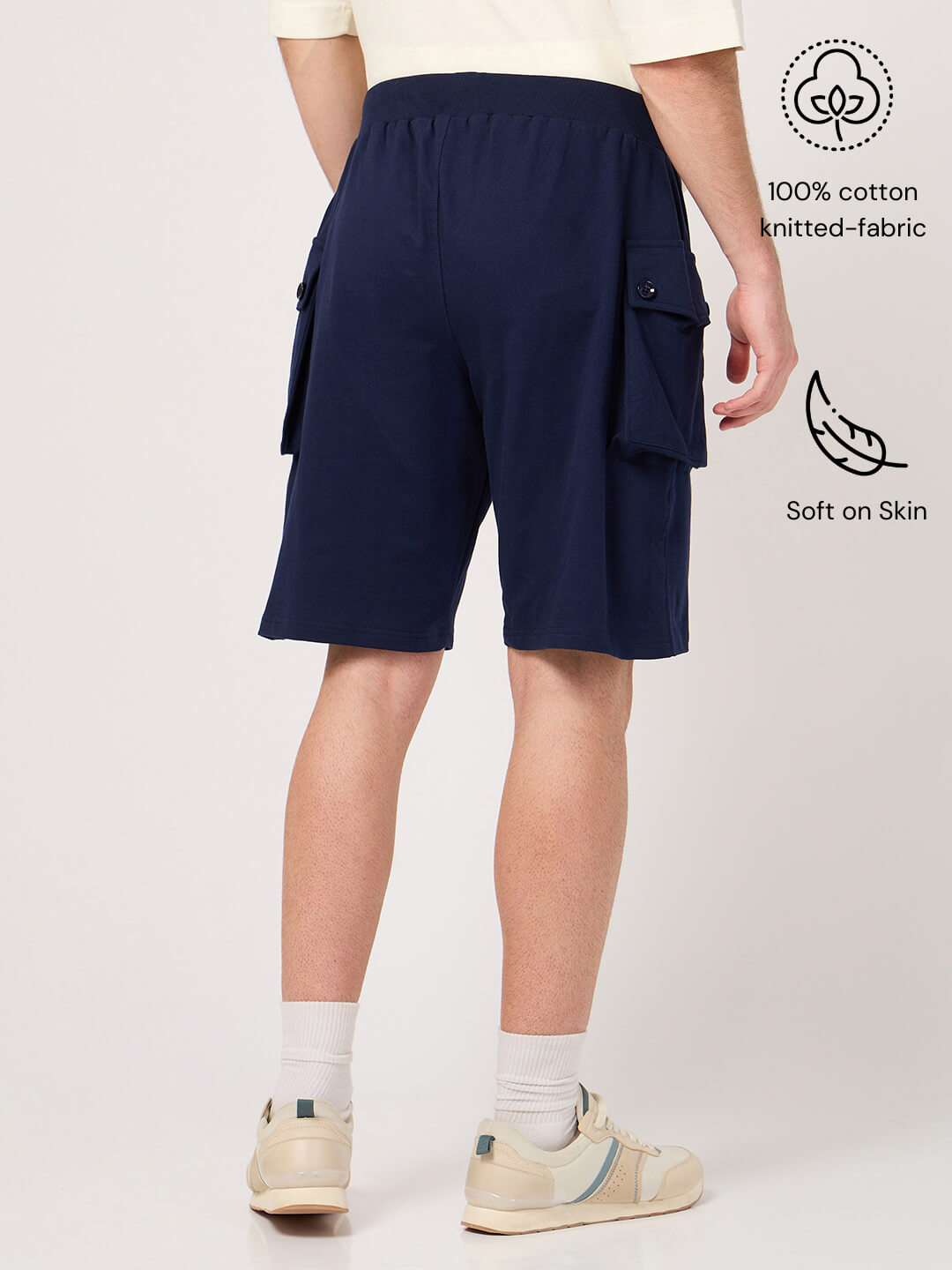 Person wearing navy cargo shorts made with pure cotton