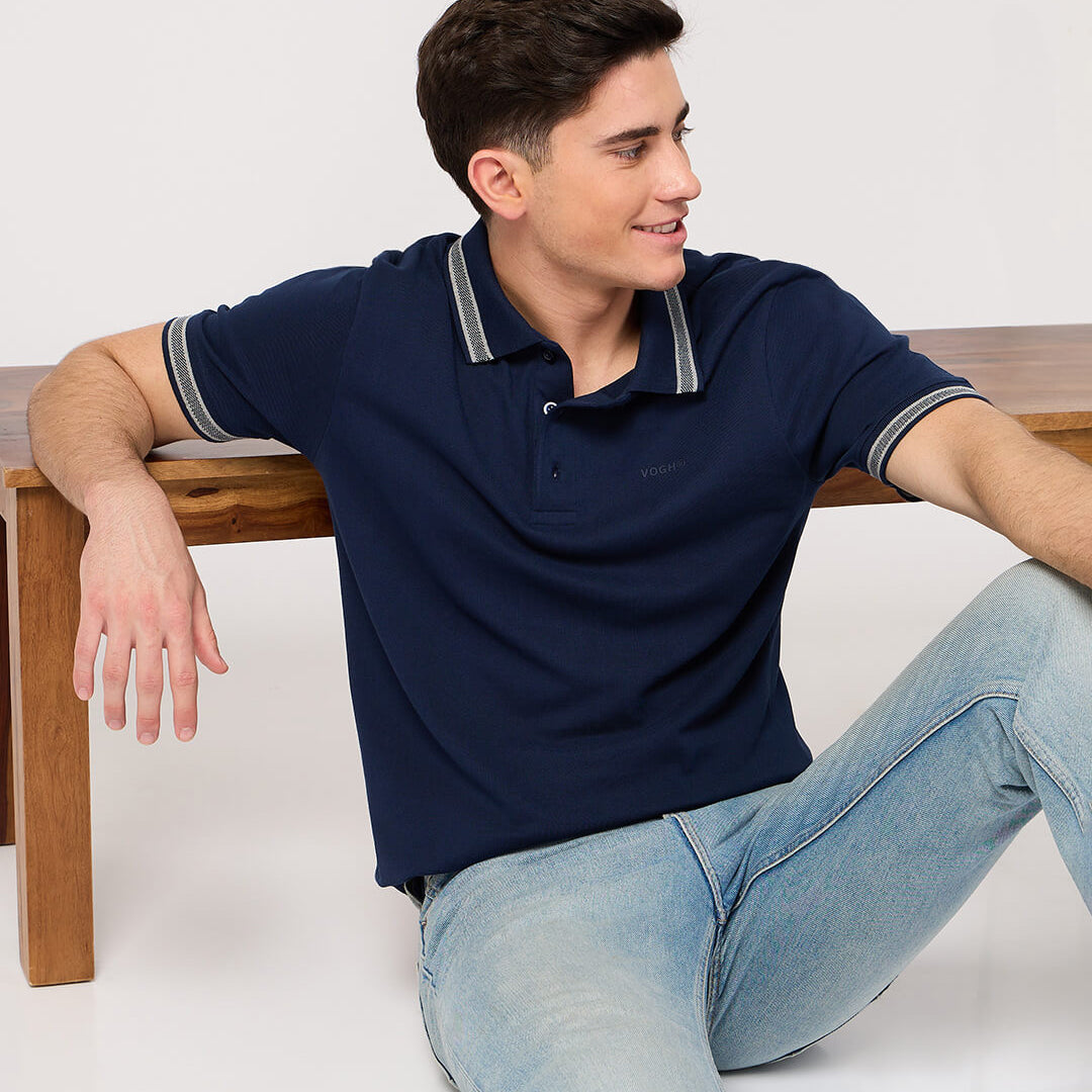 man wearing a polo t shirt and jeans