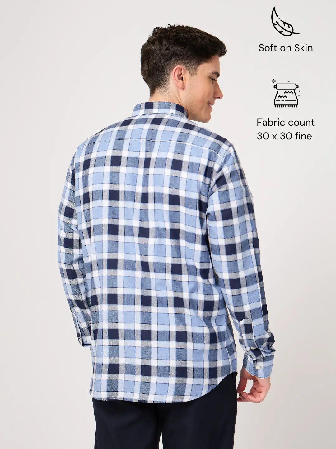 Man wearing a blue and white checkered shirt