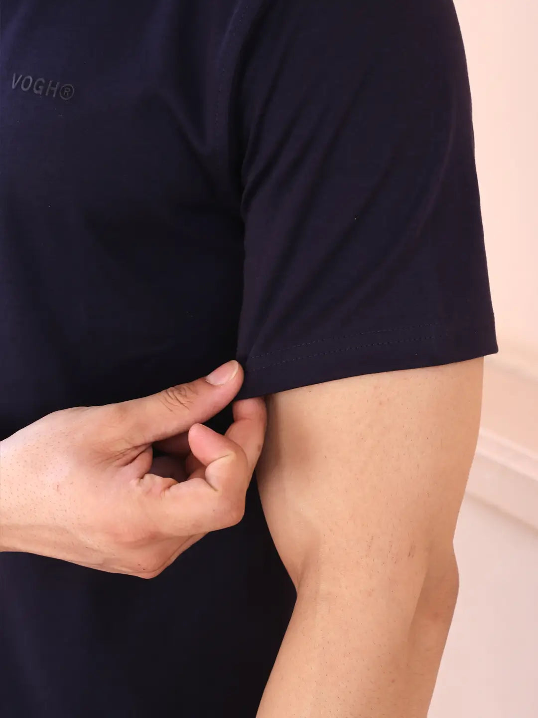 Person wearing a navy blue shirt