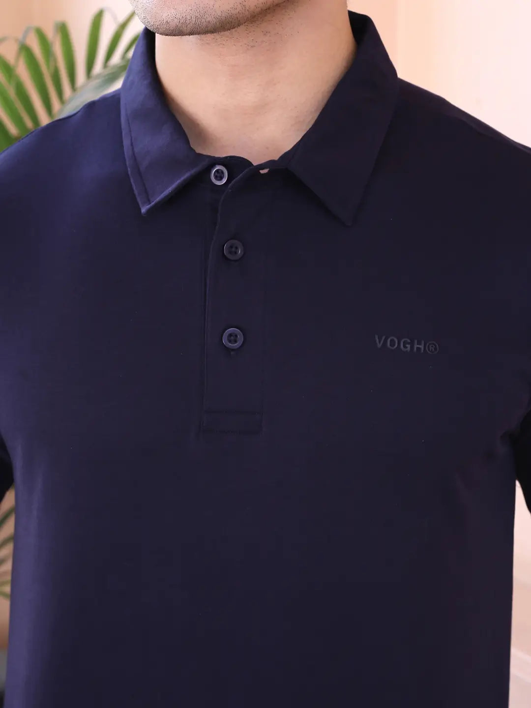 Navy blue polo shirt with a 'VOGH' brand logo