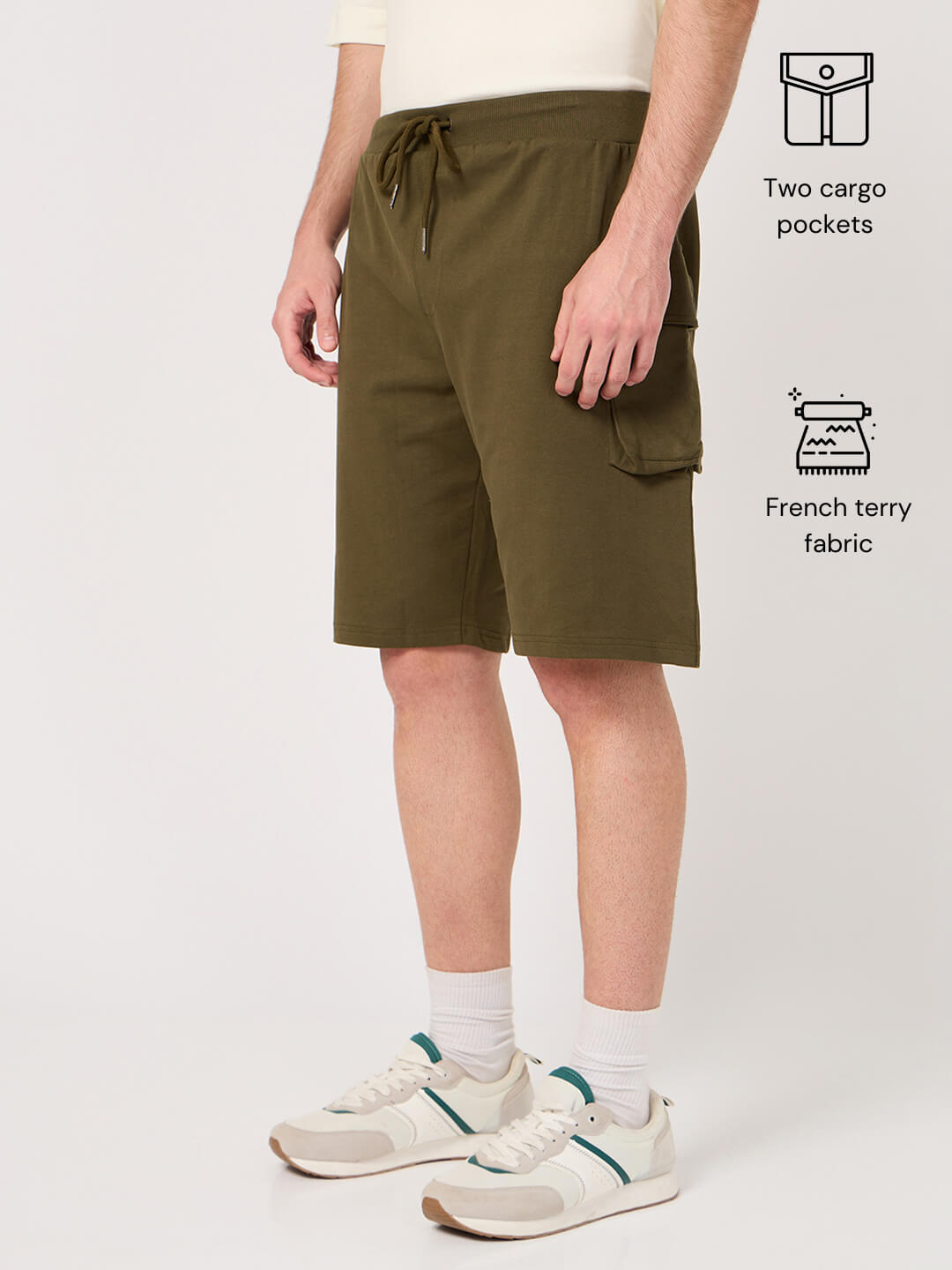 Person wearing olive green shorts with cargo pockets