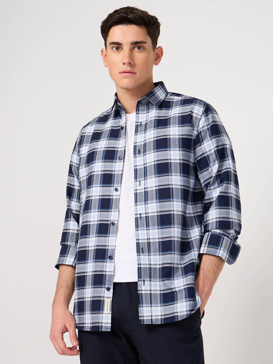 Man wearing a blue and white cotton check shirt