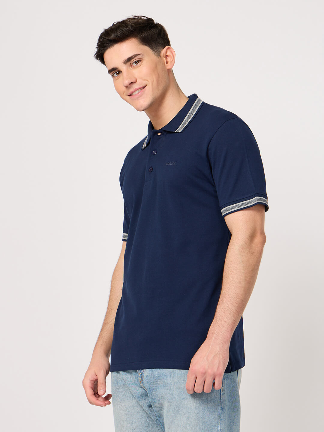 man wearing a navy blue polo shirt with jacquard collar