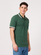 green polo shirt made from bio-washed cotton pique fabric