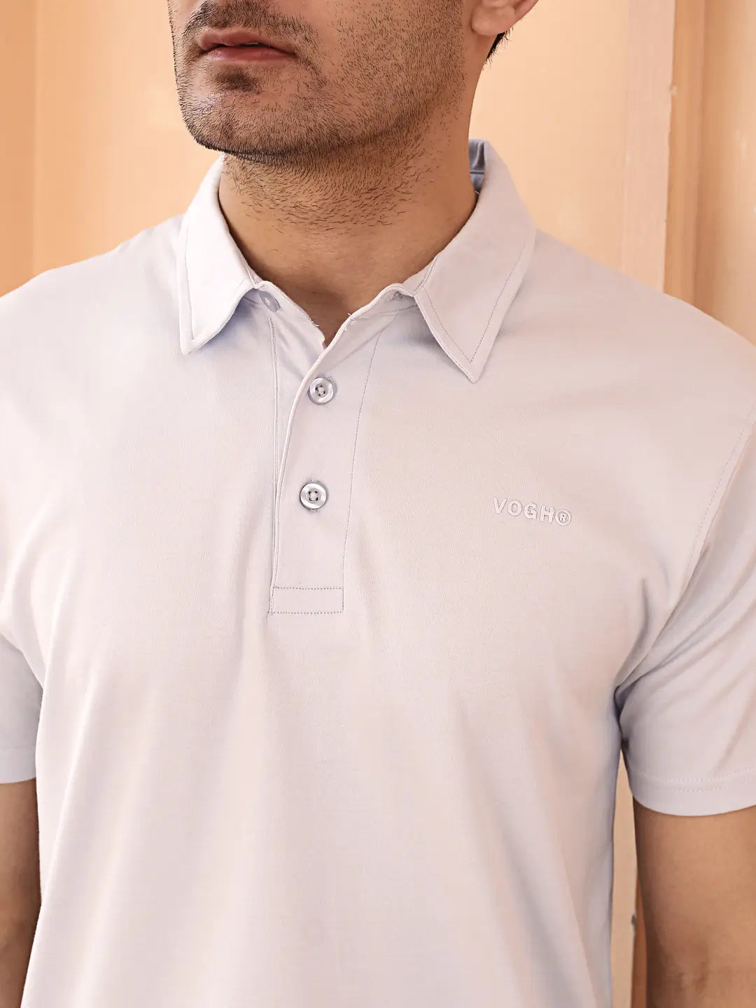 Man wearing a light sky blue polo t shirt