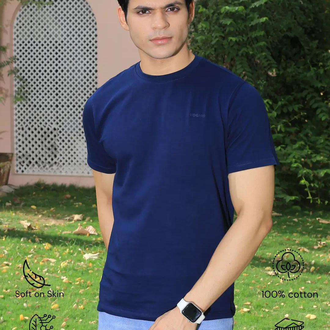 Man wearing a navy blue crew neck t-shirt