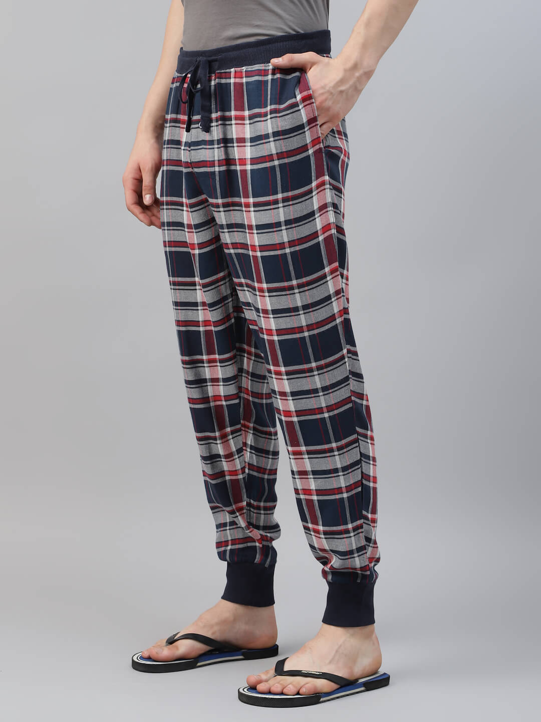 Person wearing plaid pajama pant