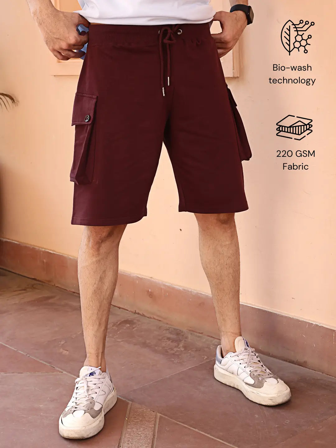 Person wearing maroon cotton cargo shorts