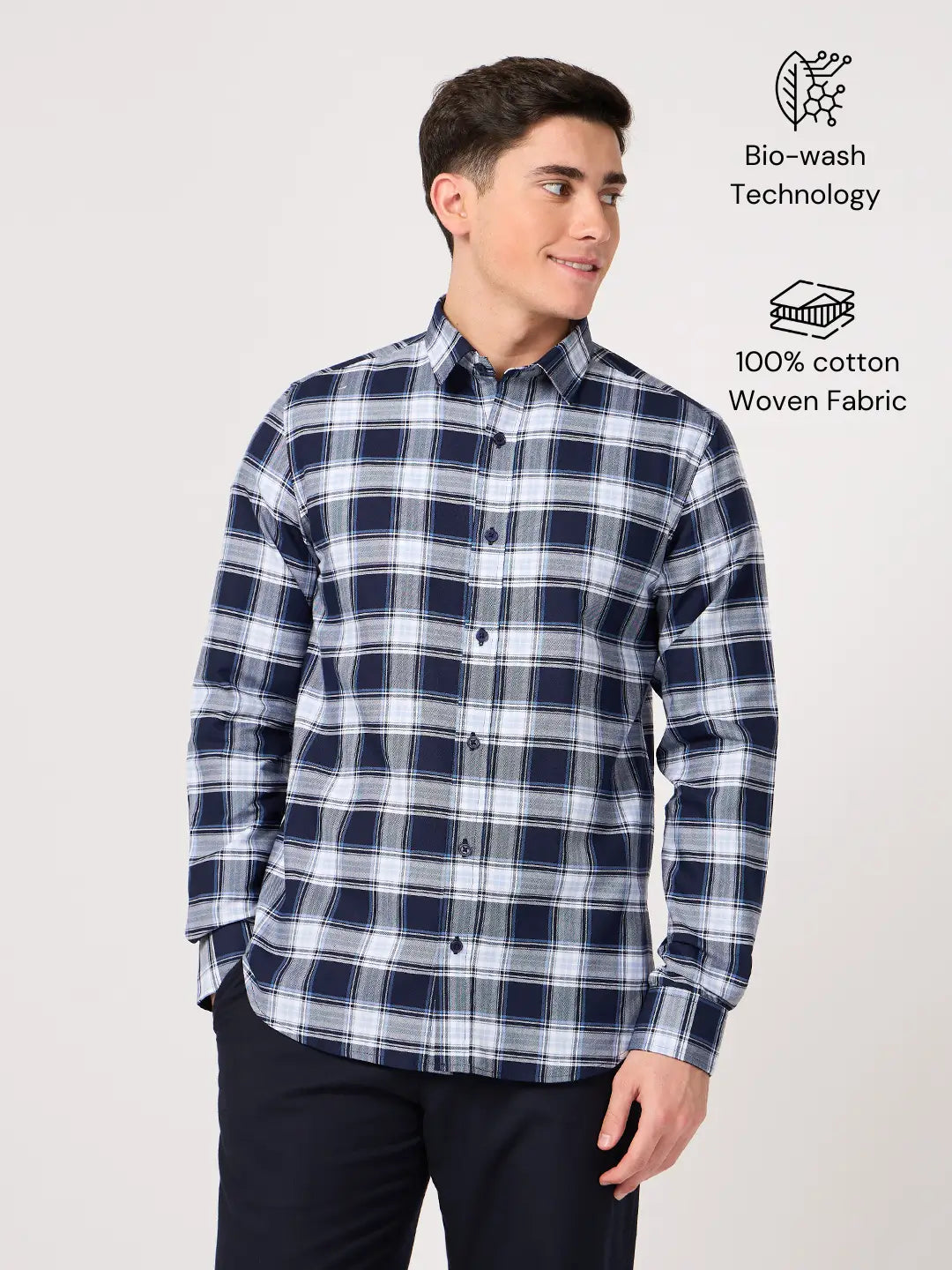 Man wearing a blue and white check shirt made with pure cotton