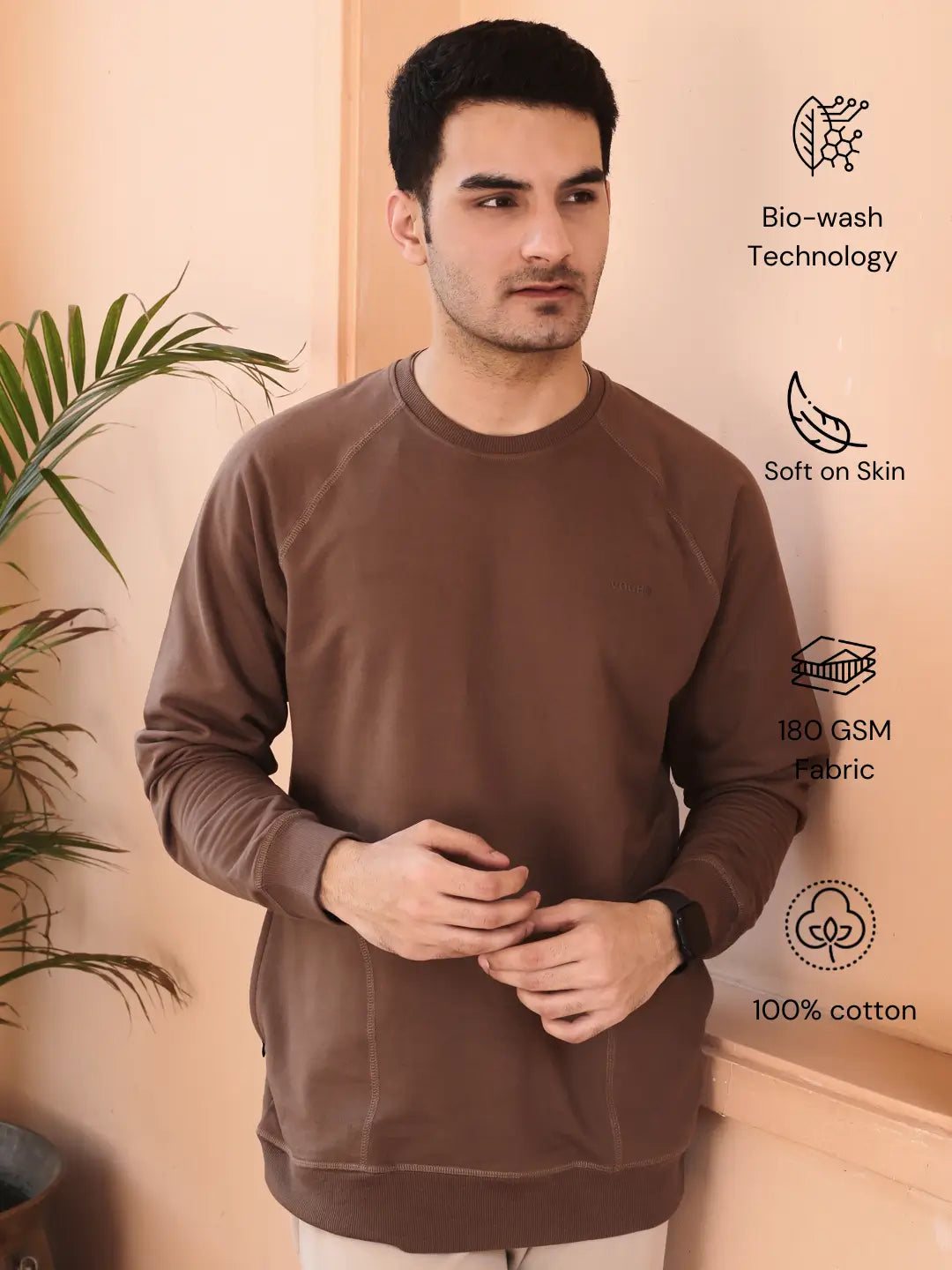 Man wearing a brown sweatshirt with pocket