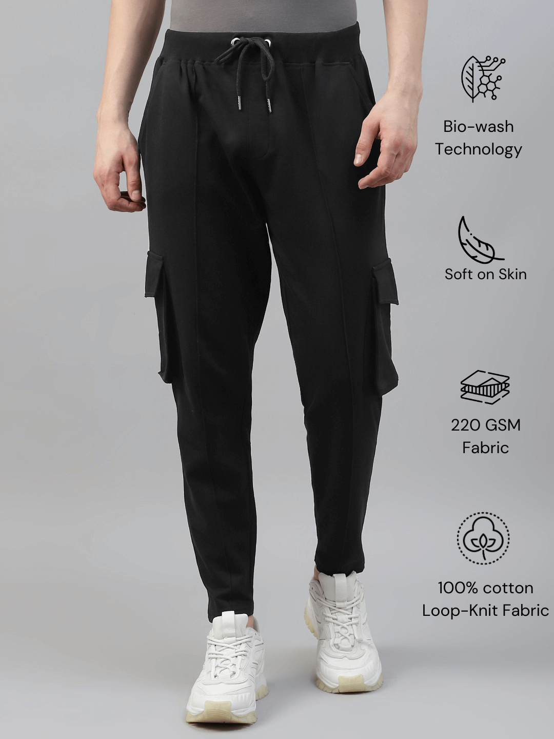 Men's cotton cargo pocket pants in black color, featuring multiple pockets and a drawstring waist.