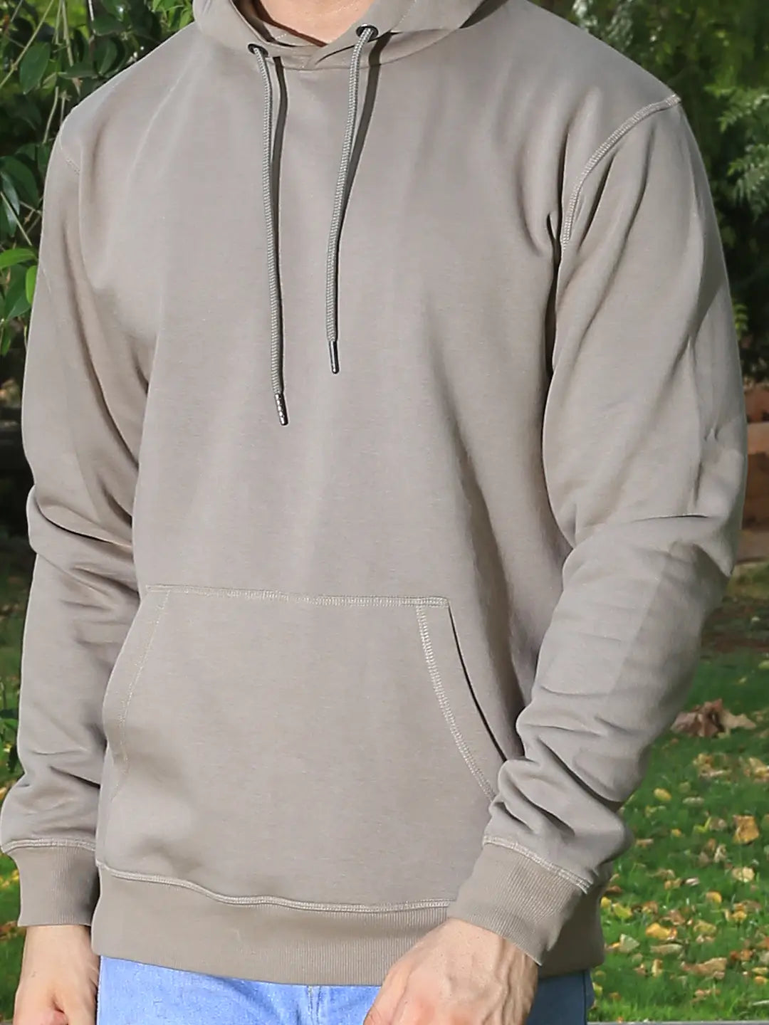 Person wearing a light gray hoodie