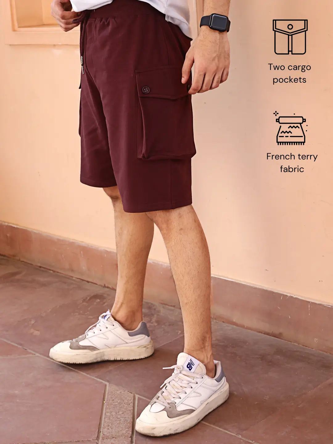 Person wearing maroon cargo shorts