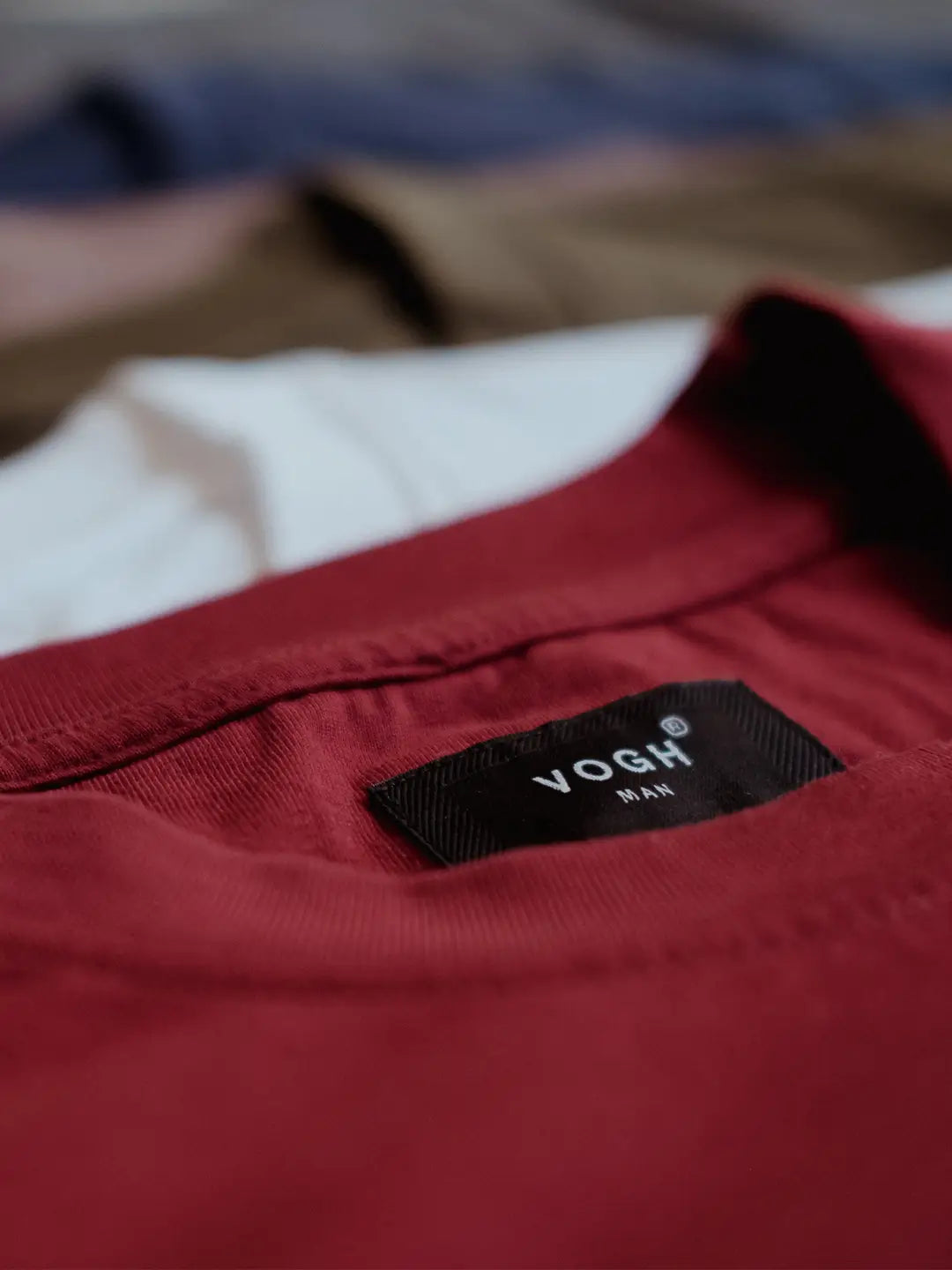 Close-up of a red round neck t shirt with a VOGH brand label