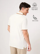 Man wearing a white cotton polo shirt