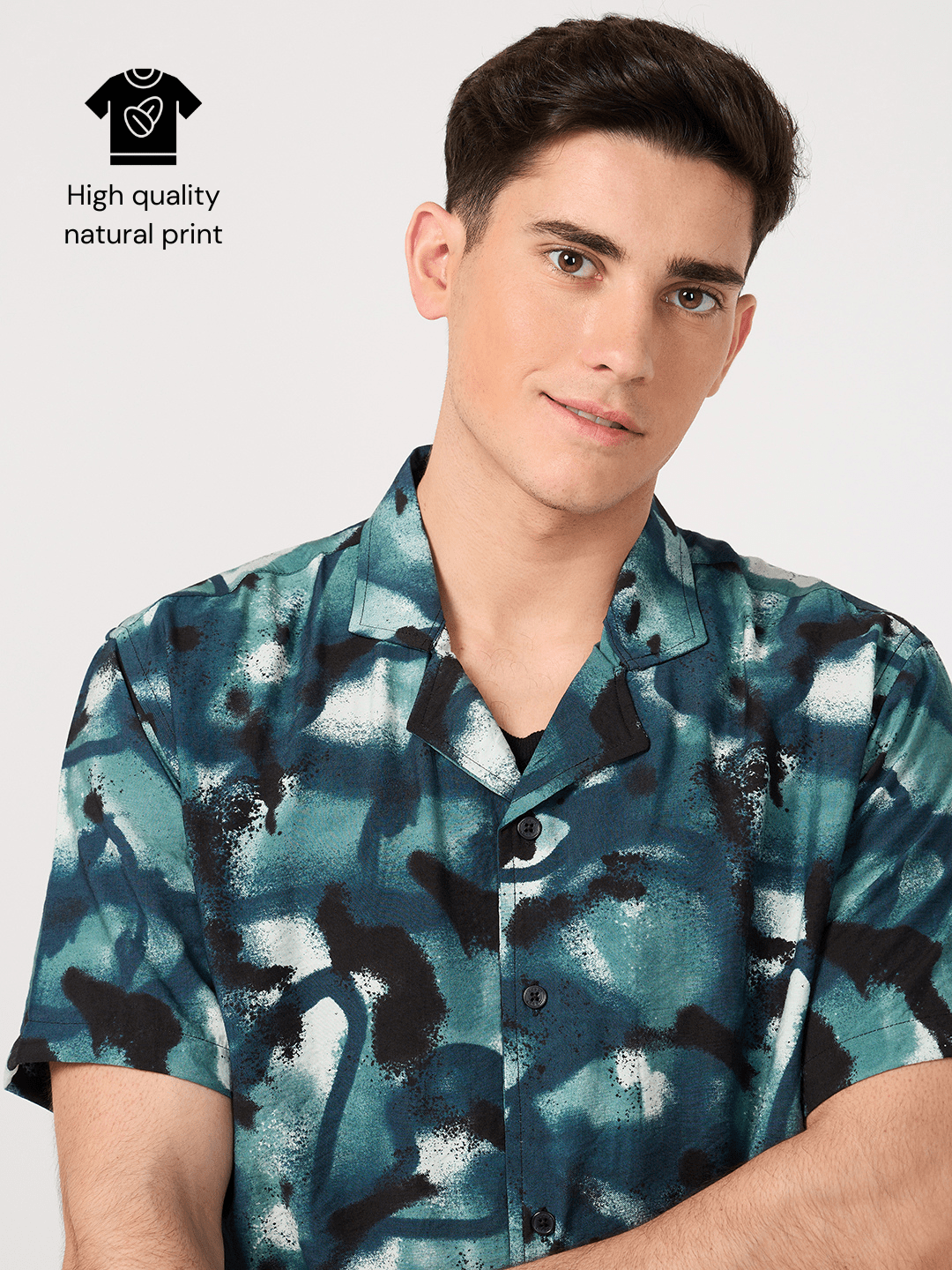 A man wearing a high quality blue rayon resort shirt