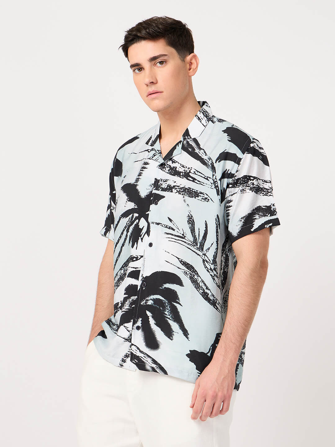 men wearing a resort shirt with a tropical print