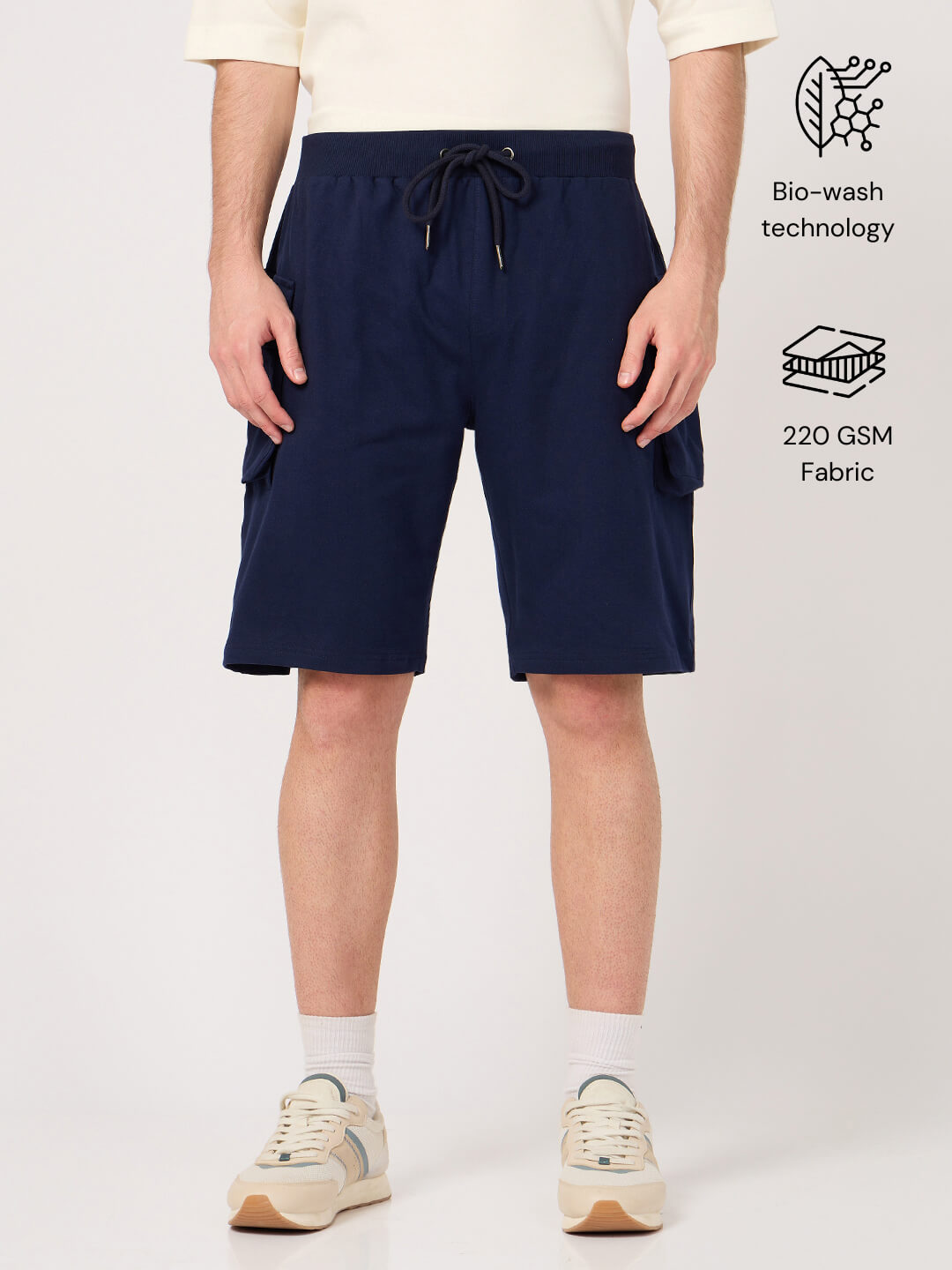 Person wearing navy shorts